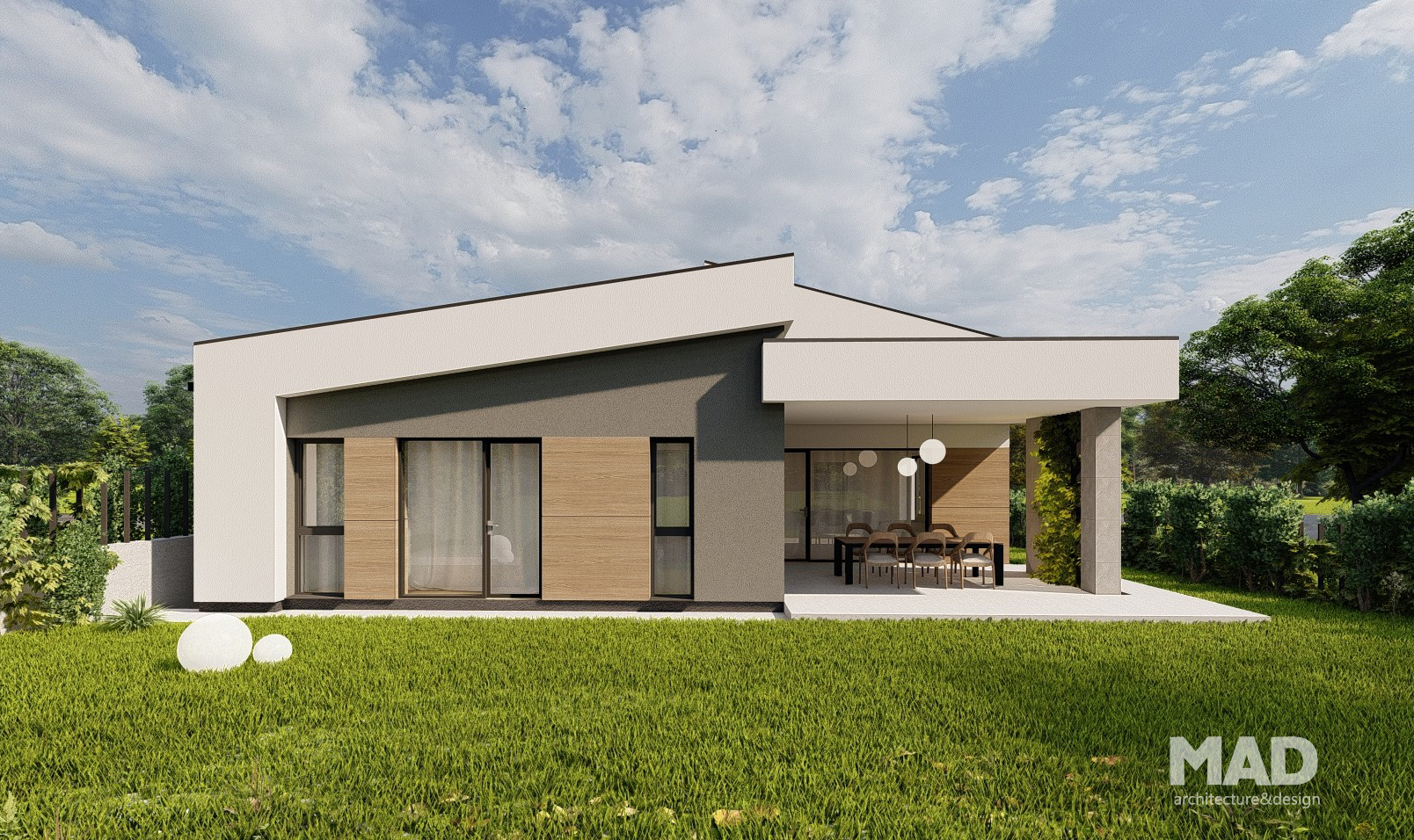 Fațada din spate a unei case moderne parter realizată de MAD architecture&design, cu terasă acoperită, pereți în combinație lemn–tencuială gri și albă, acoperiș șarpantă asimetrică; arhitectură contemporană rezidențială premium.