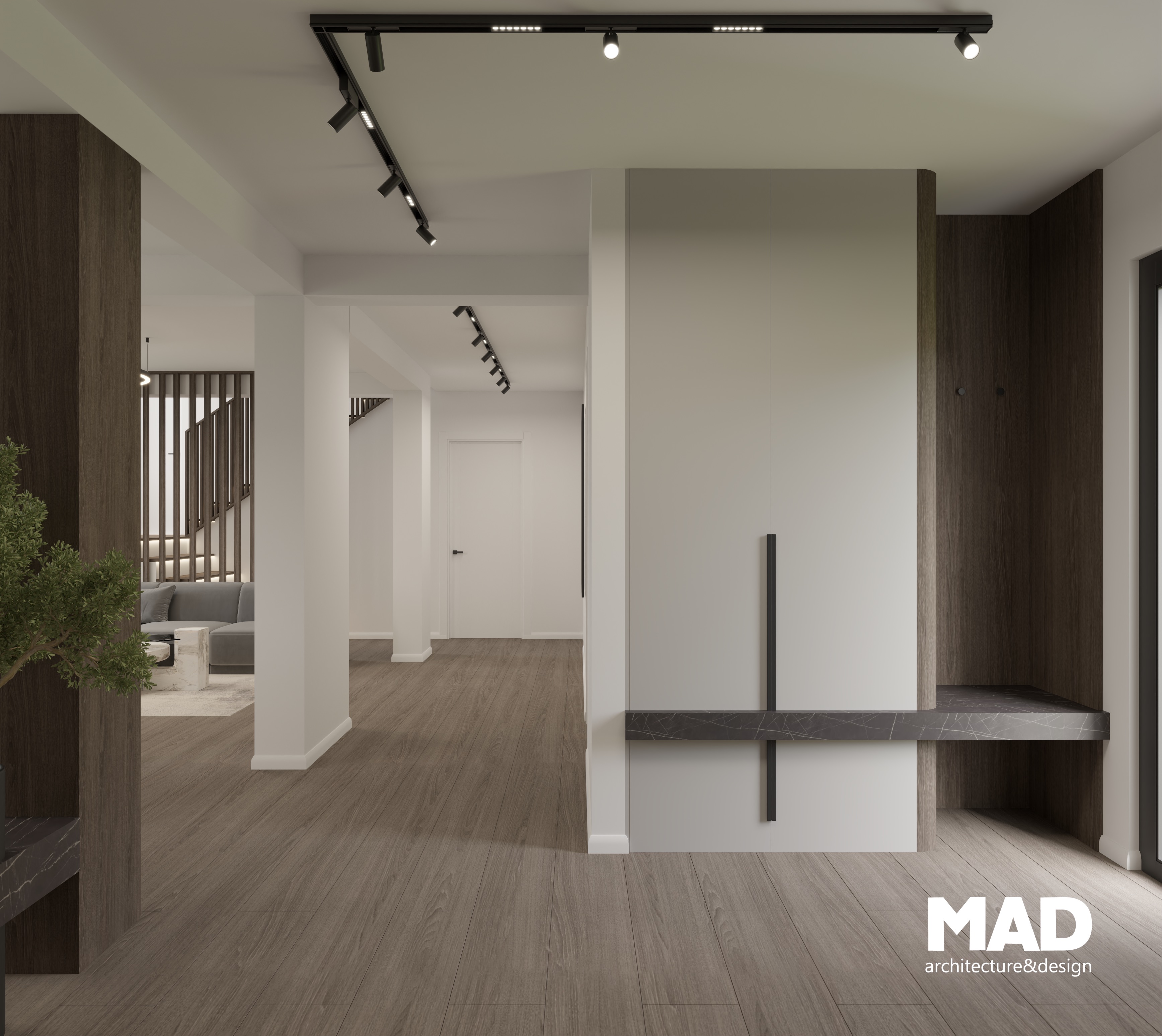 Spațiu de intrare minimalist, cu dulap alb mat și detalii de lemn închise la culoare, design funcțional și elegant de MAD architecture&design.