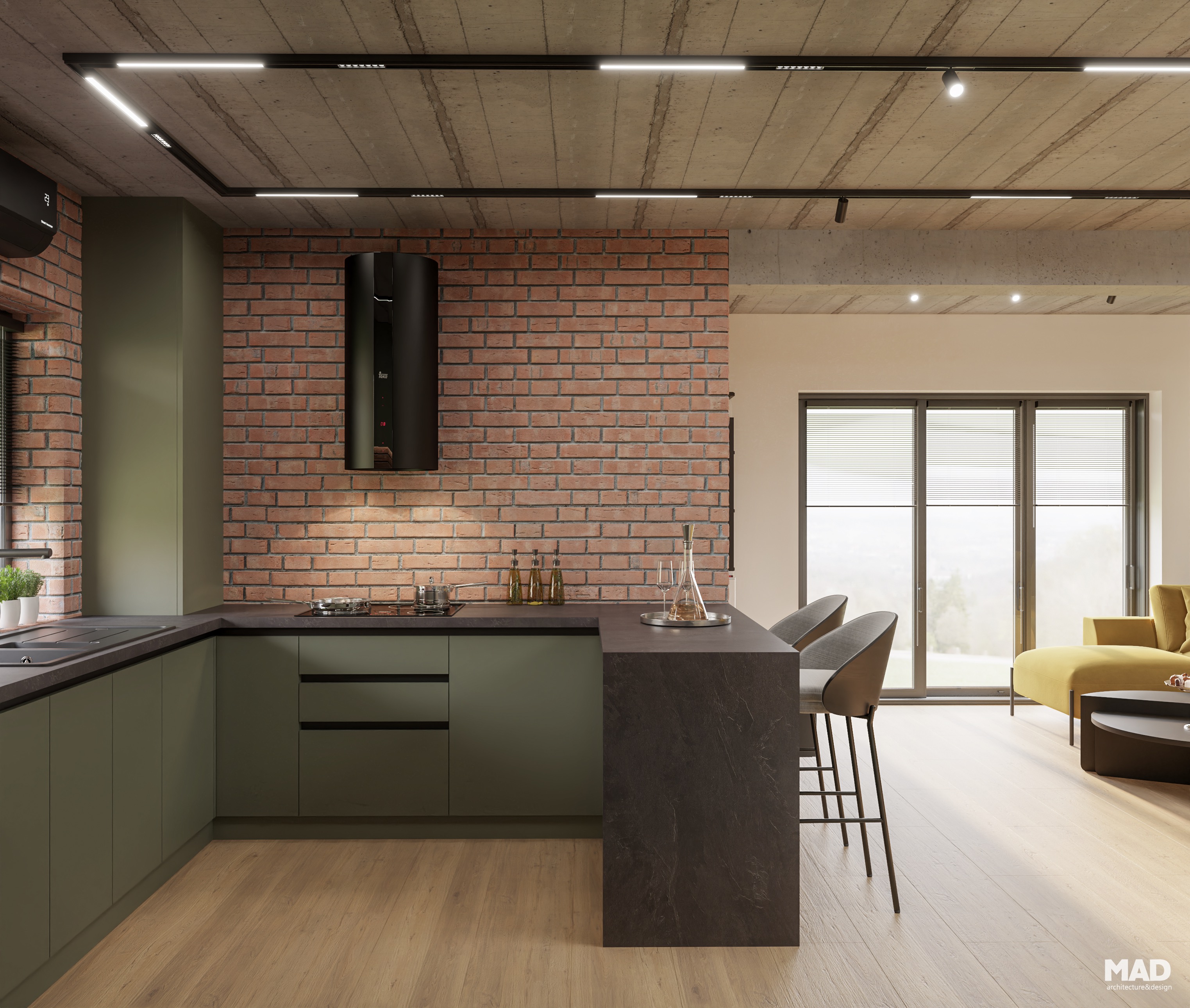 Bucătărie în stil industrial cu mobilier verde mat, perete de cărămidă și hotă neagră cilindrică, realizată de MAD architecture&design.