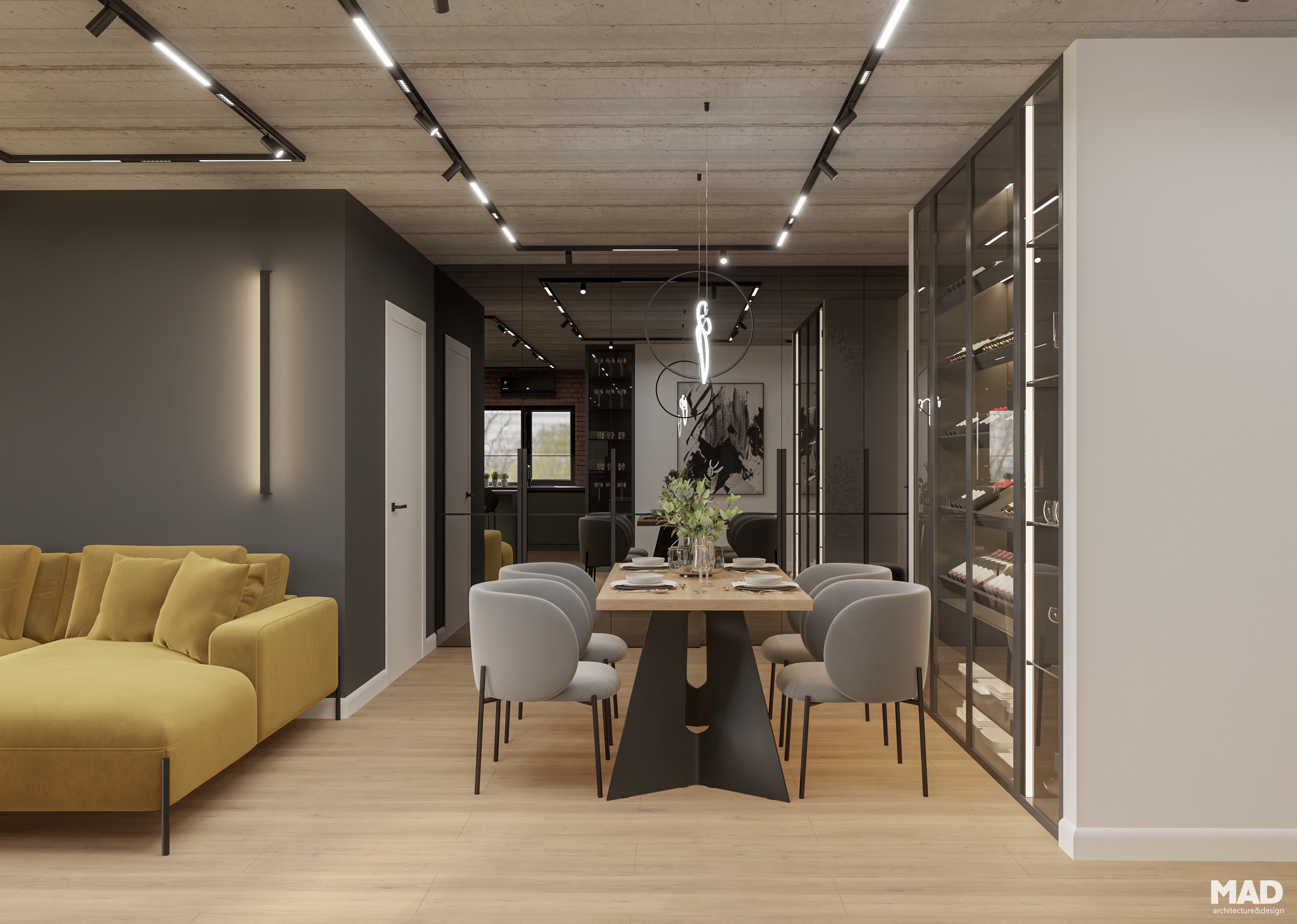 Vedere spre zona de dining și living cu canapea galbena și masă din lemn natural, design industrial elegant de MAD architecture&design.