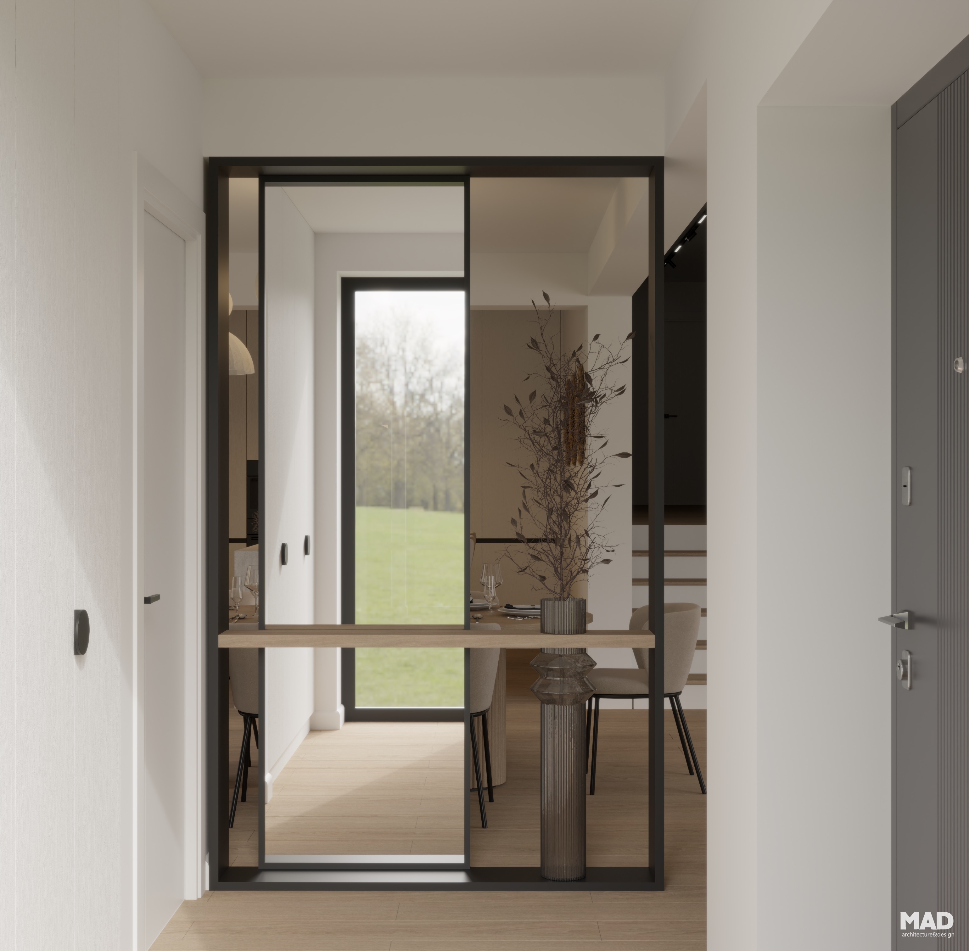 Panou decorativ cu oglindă și elemente metalice negre, delimitând zona de intrare în amenajarea Casa L, proiect MAD architecture&design