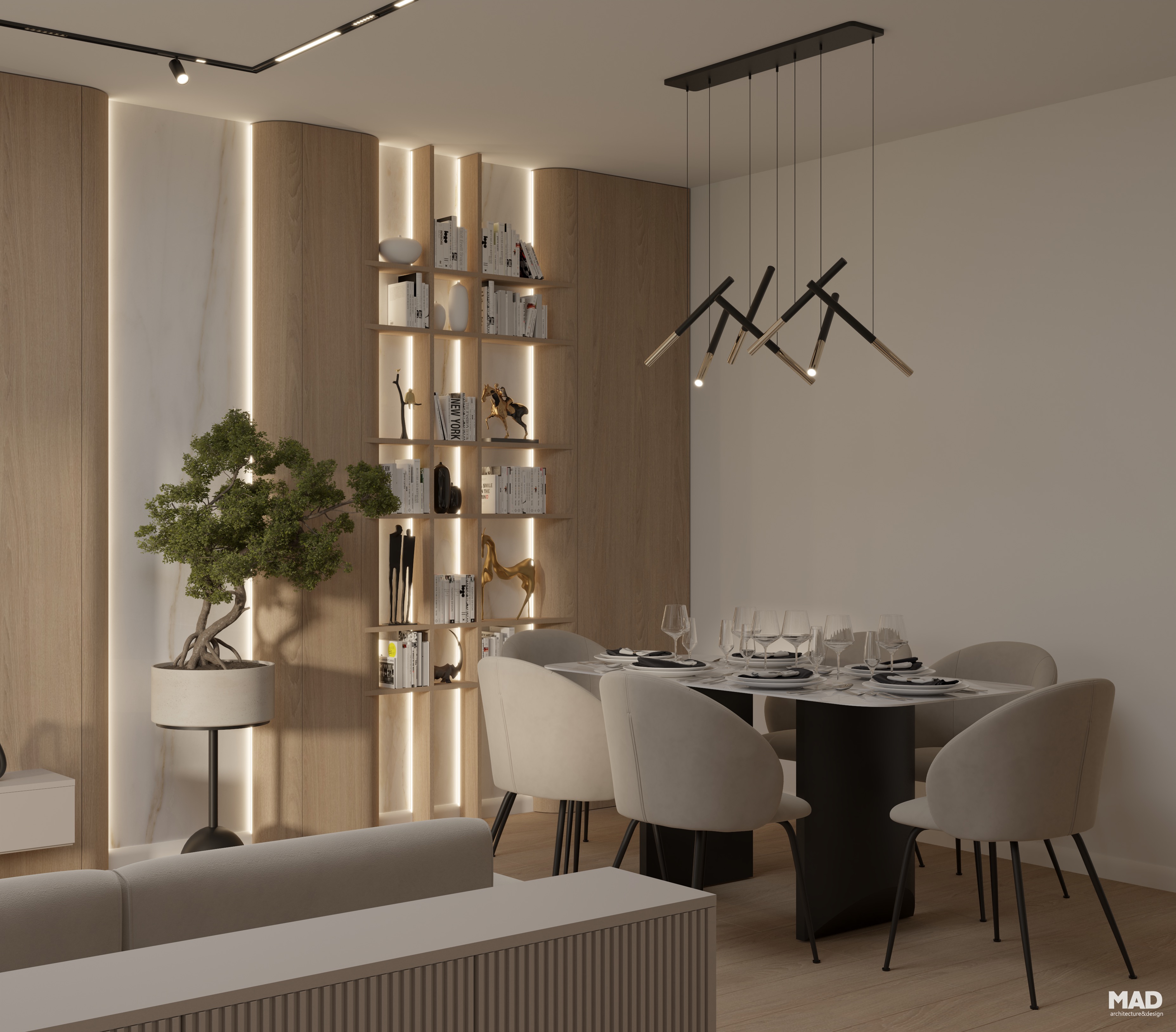 Zona de dining modernă cu masă centrală, scaune tapițate și bibliotecă iluminată cu LED, finisaje calde din lemn și marmură – design MAD architecture&design.