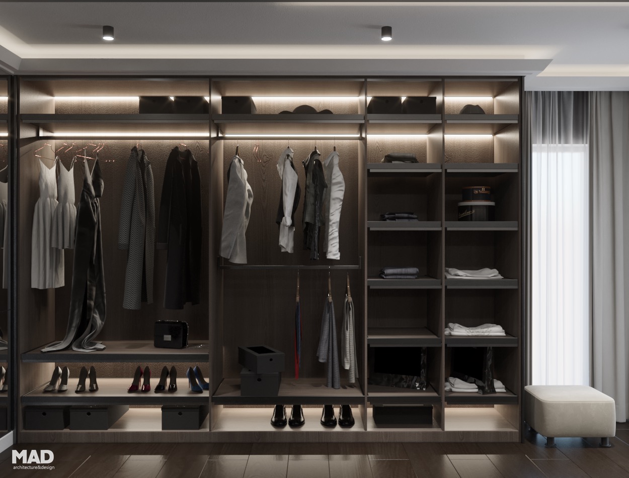 Dressing luxury realizat pe comandă, cu mobilier din lemn închis, iluminare LED și compartimentare rafinată, semnat de MAD architecture&design.