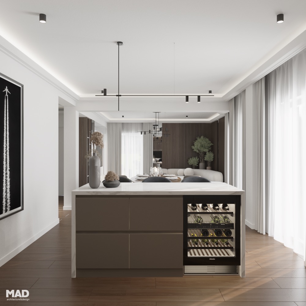 Bucătărie luxury contemporană cu insulă centrală placată în marmură albă, fronturi mate și frigider pentru vinuri, design realizat de MAD architecture&design.