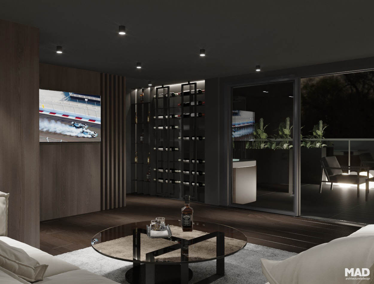 Spațiu lounge luxury cu zonă de relaxare, vitrine pentru vinuri și deschidere către terasa acoperită, design semnat de MAD architecture&design.