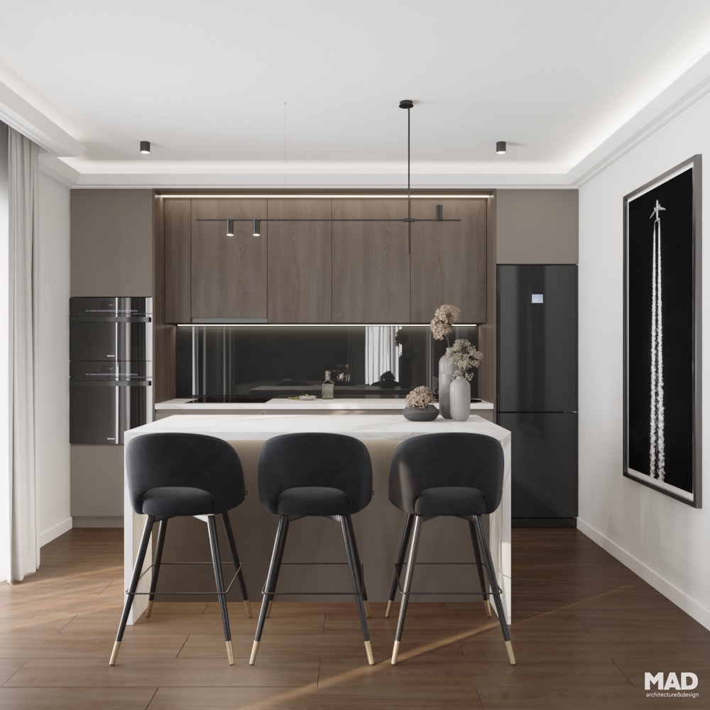 Bucătărie contemporană de lux cu insulă centrală, scaune din catifea neagră și detalii aurii rafinate, proiect realizat de MAD architecture&design.