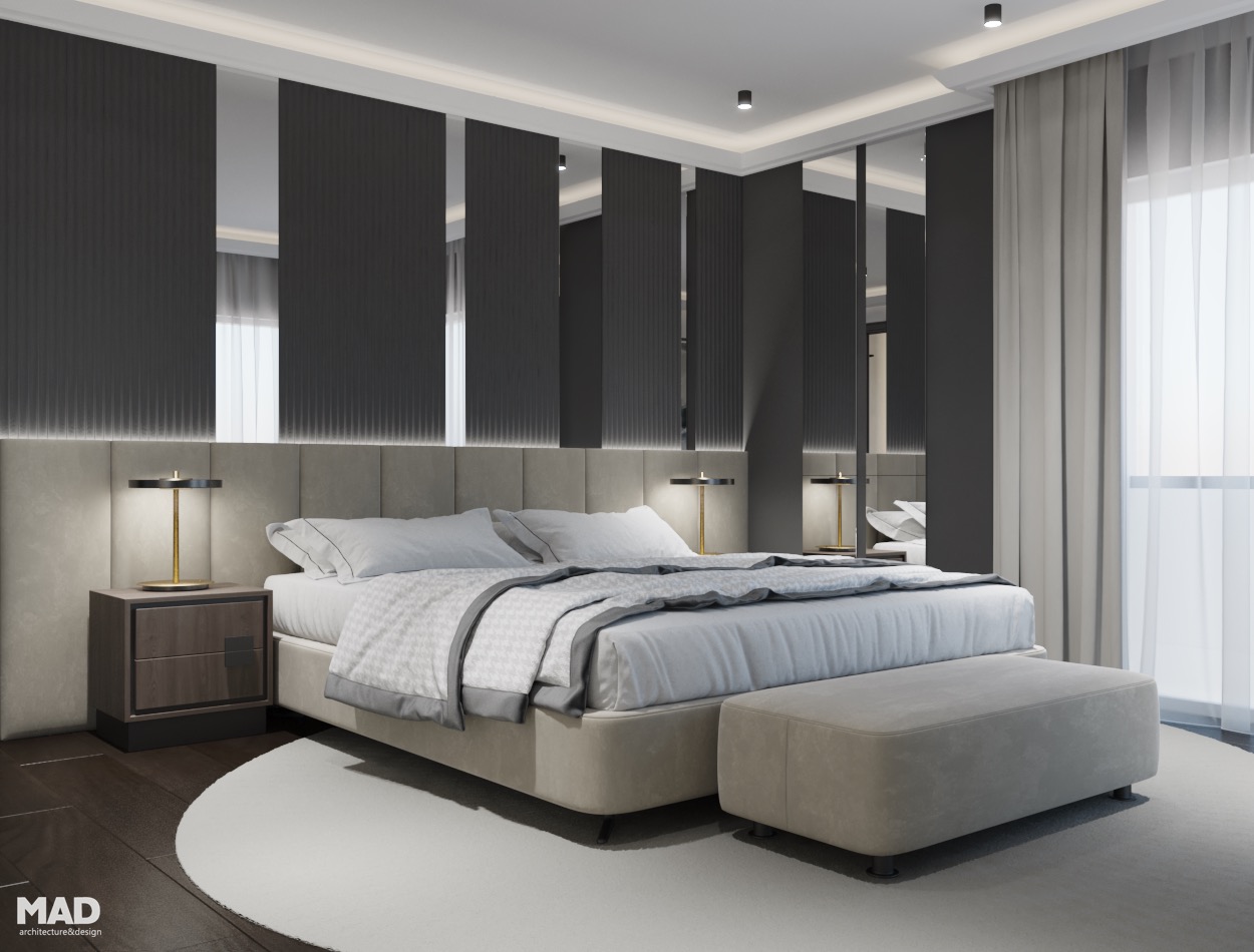Dormitor de lux cu tăblie tapițată, oglinzi decorative și detalii aurii, amenajare semnată de MAD architecture&design.